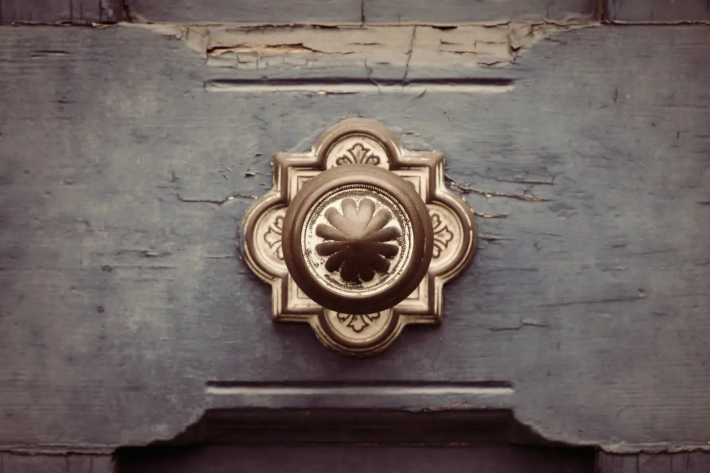 Brass handle on an old wooden door